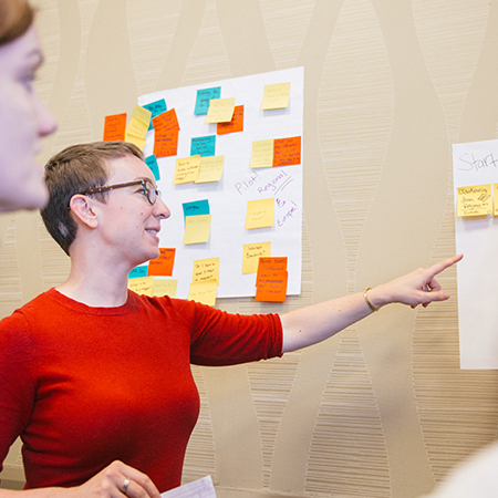 Woman pointing at presentation